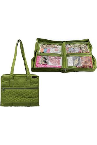 a green suitcase sitting on top of a green surface